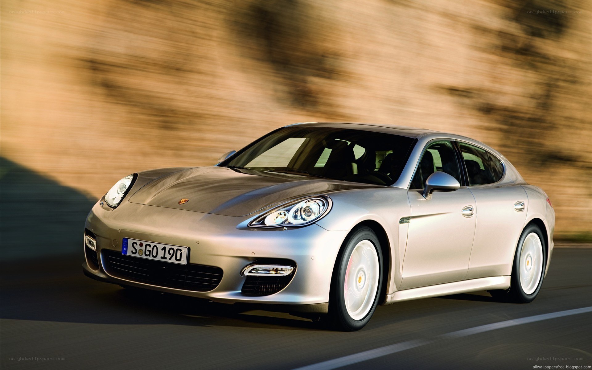 silver porsche panamera in motion