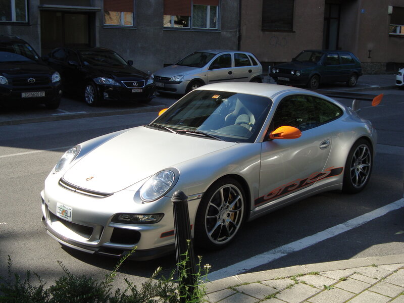 silver porsche parked on street