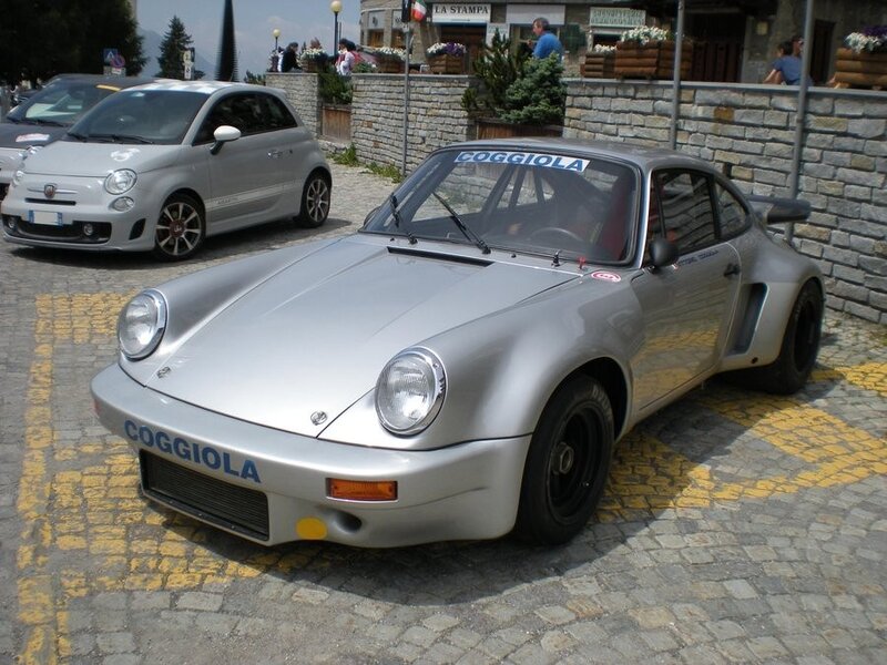 Silver Porsche race car on display