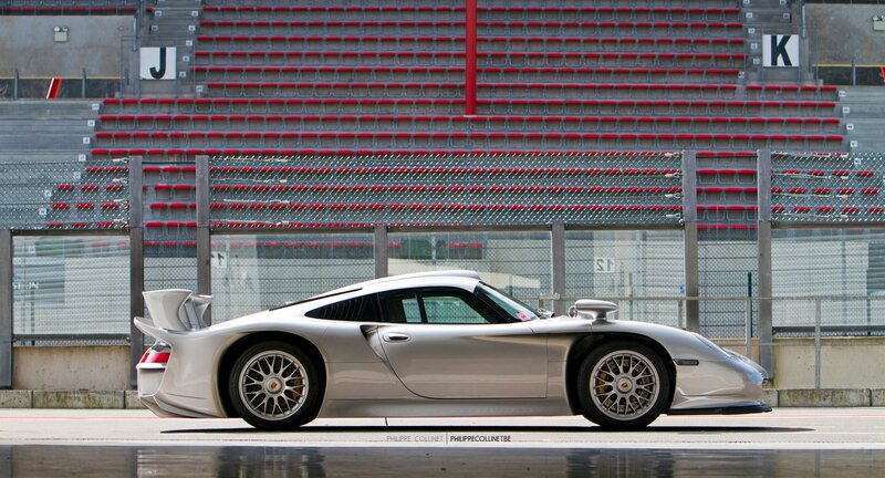 Silver Porsche race car on track