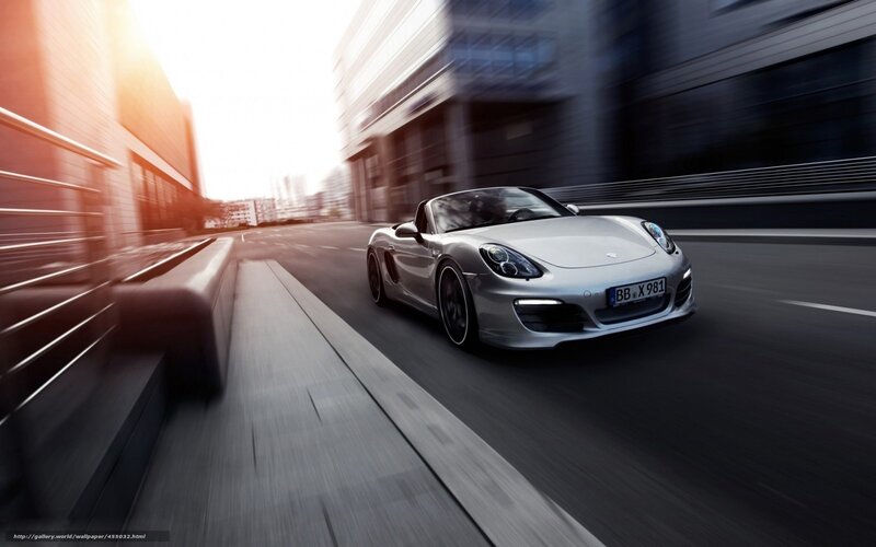Silver Porsche speeding through city