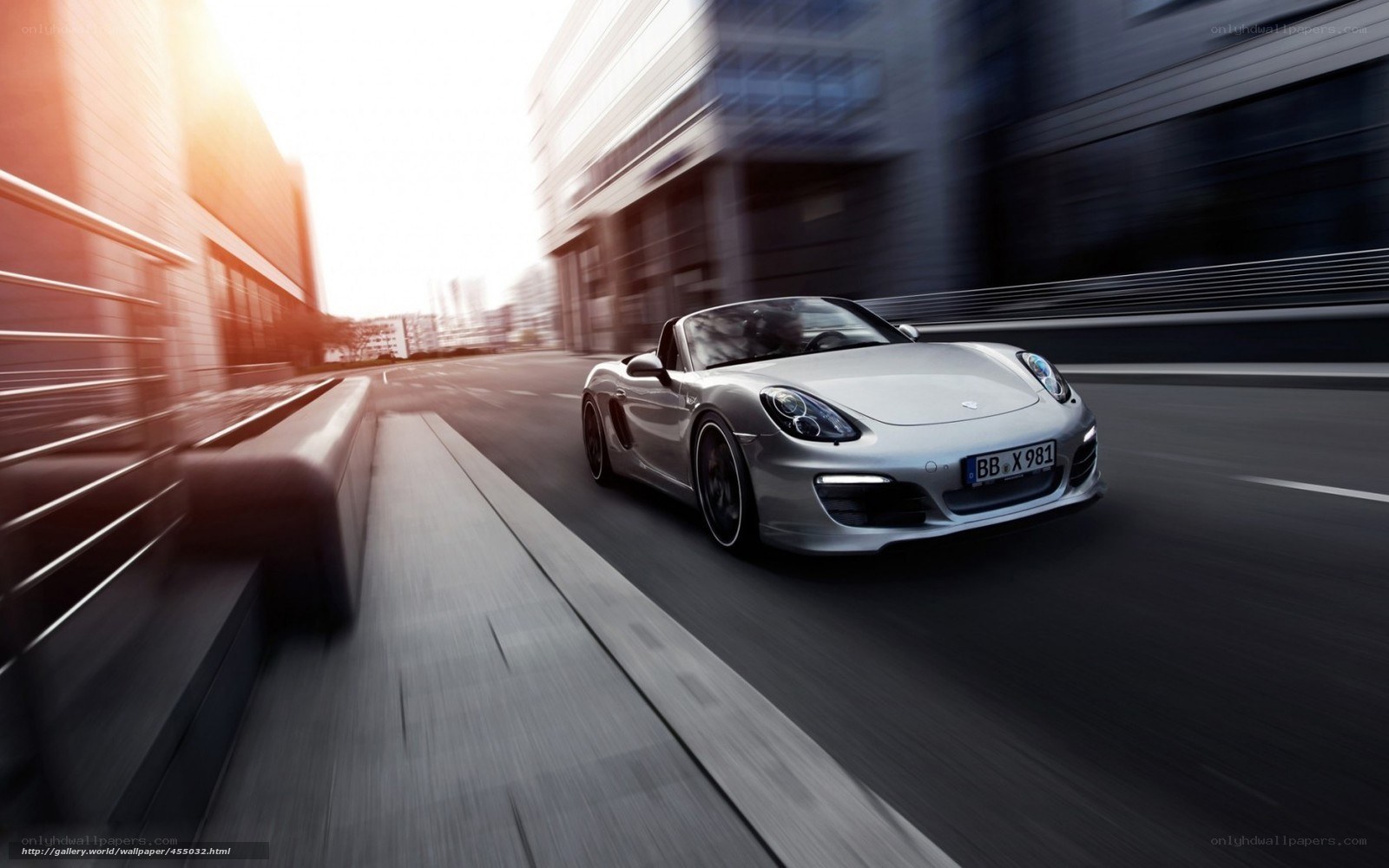 Silver Porsche speeding through city