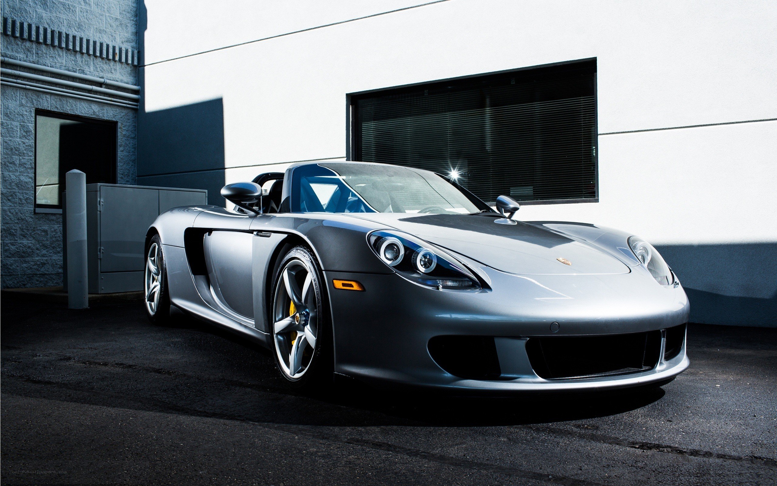 Silver Porsche Spyder parked