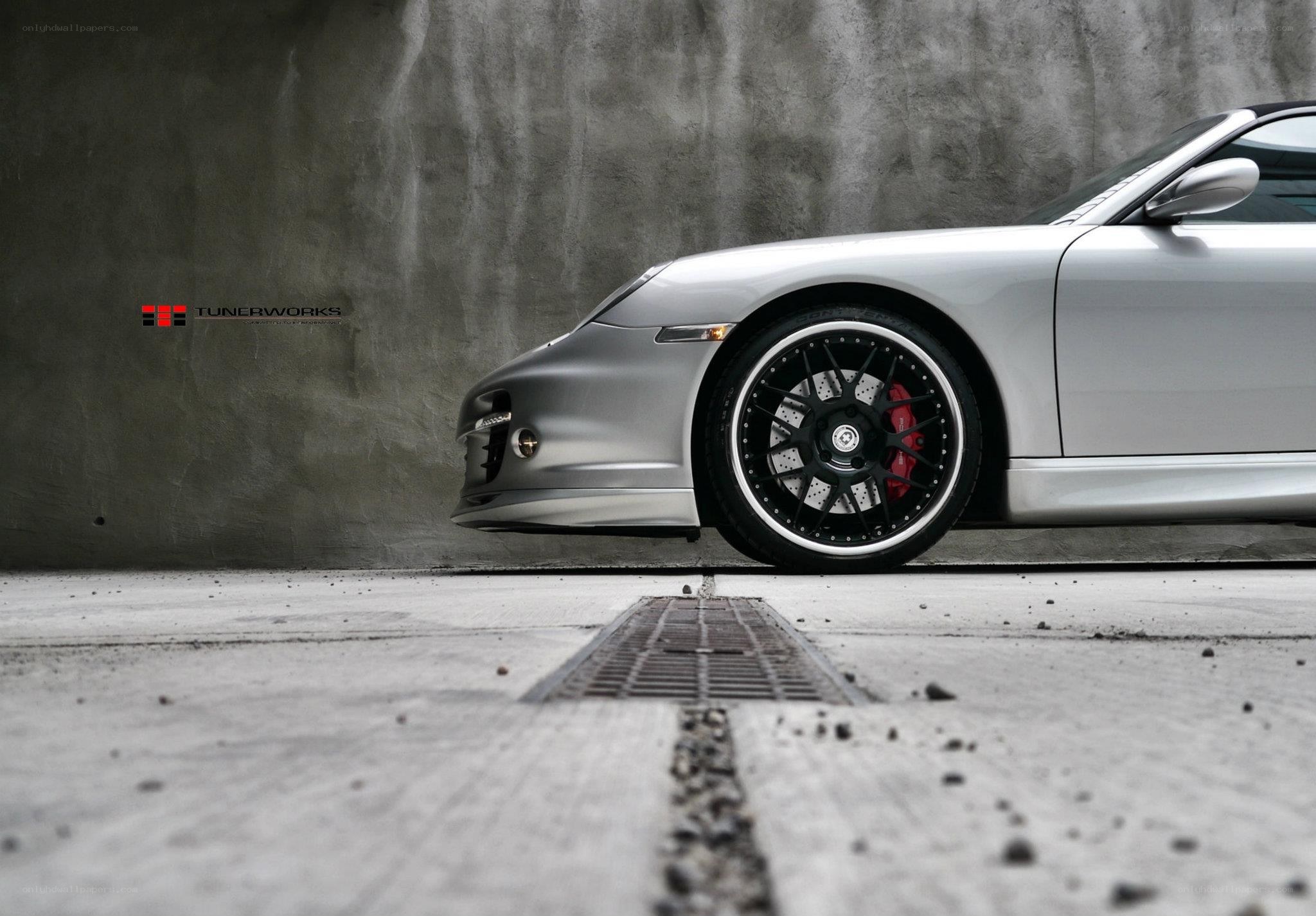 silver porsche with custom wheels