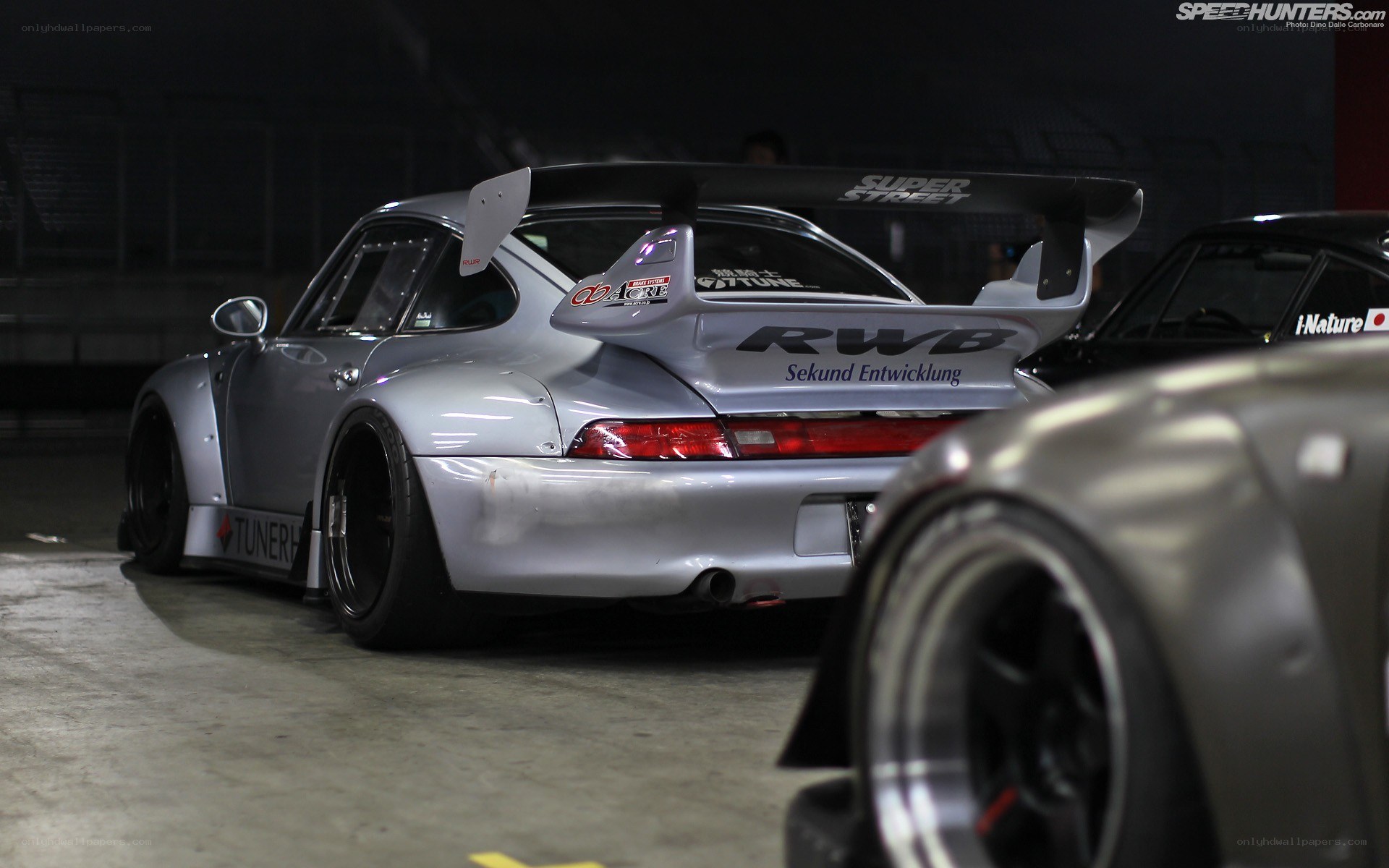 silver porsche with large rear wing