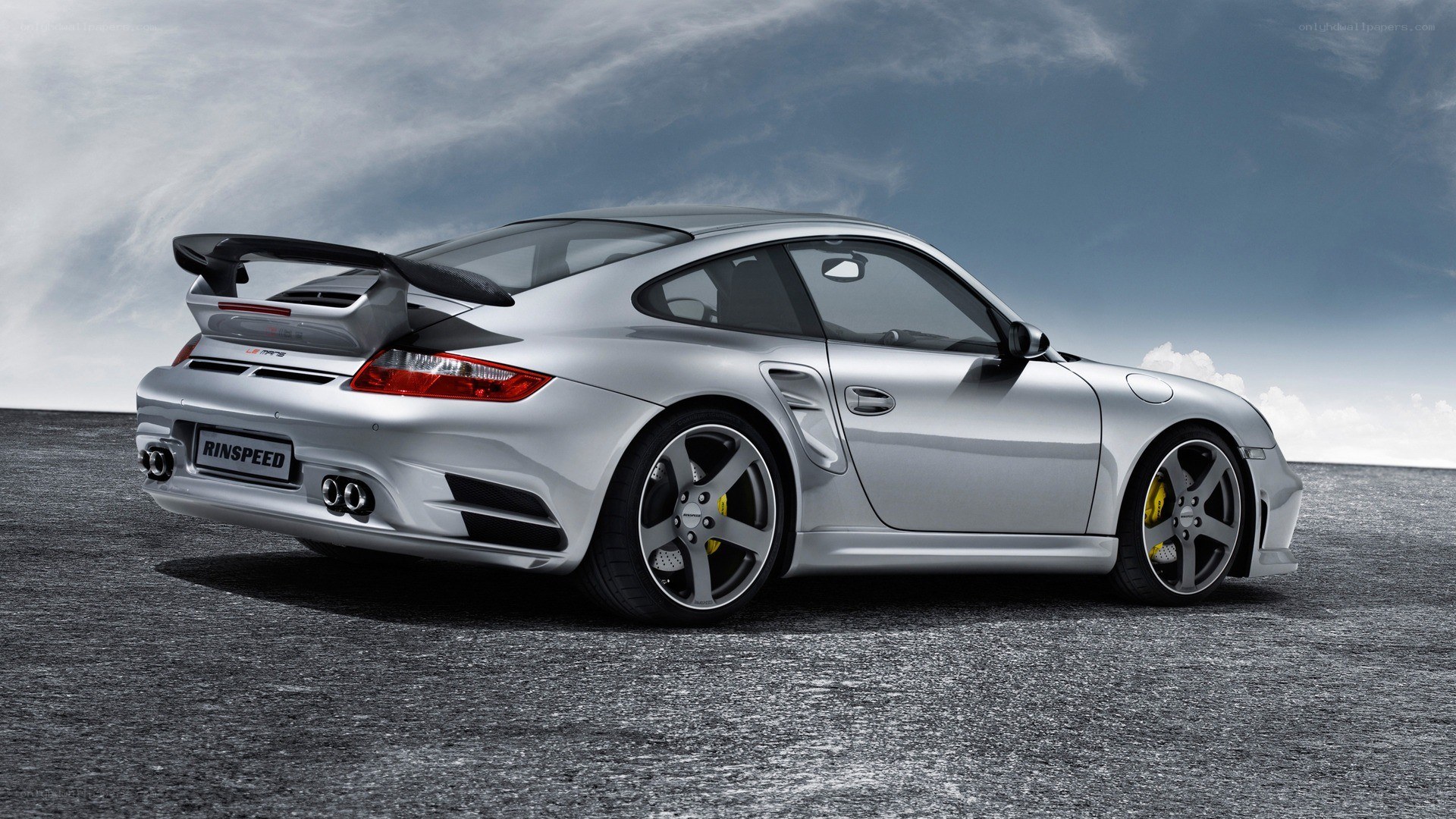 silver porsche with rear spoiler