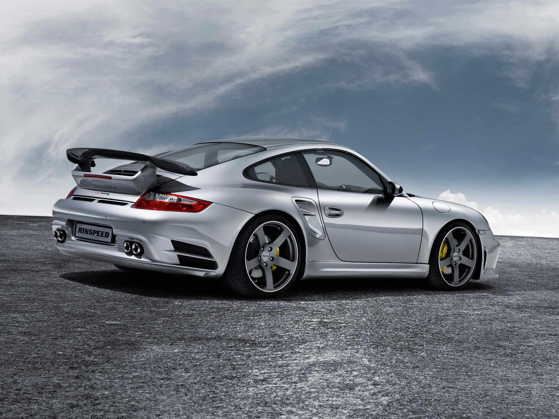 silver porsche with rear spoiler