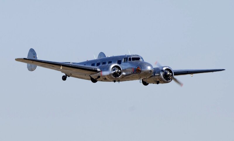 Silver Propeller Airplane — Gray