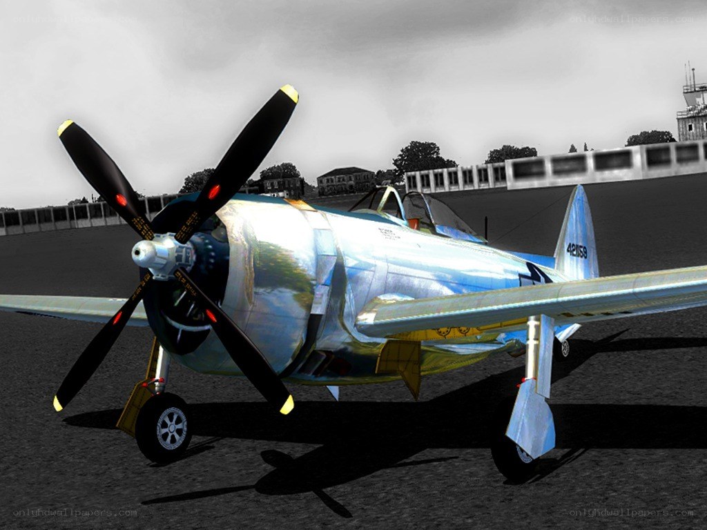 silver propeller plane on tarmac