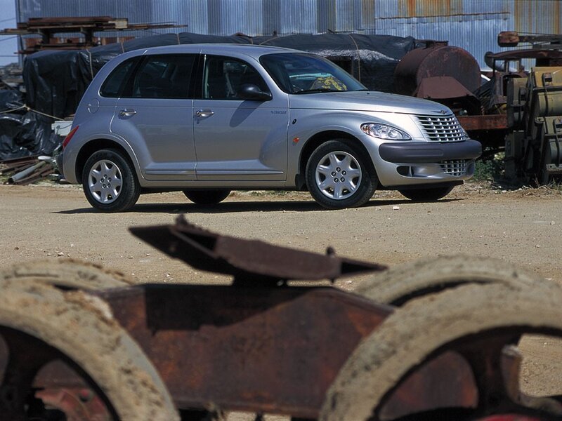 Silver PT Cruiser in junkyard