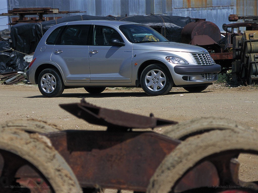 Silver PT Cruiser in junkyard