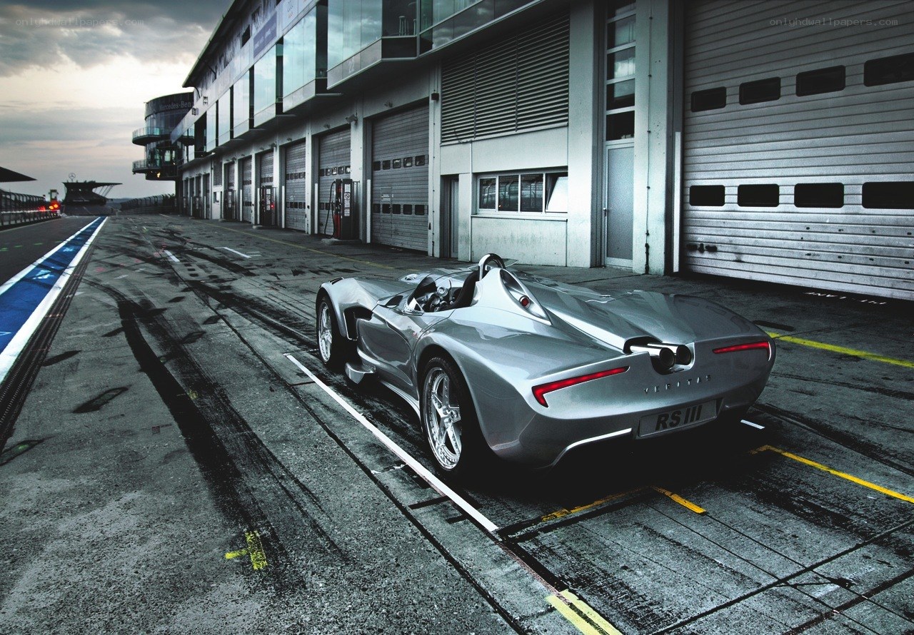 Silver race car at a track