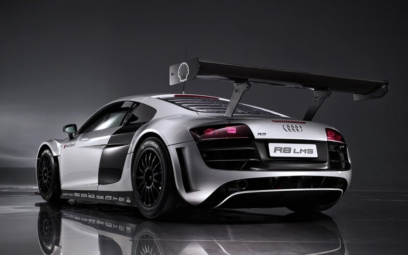 Silver Race Car — Dramatic, Photograph, Carbon Fiber Wing, Shell Logo