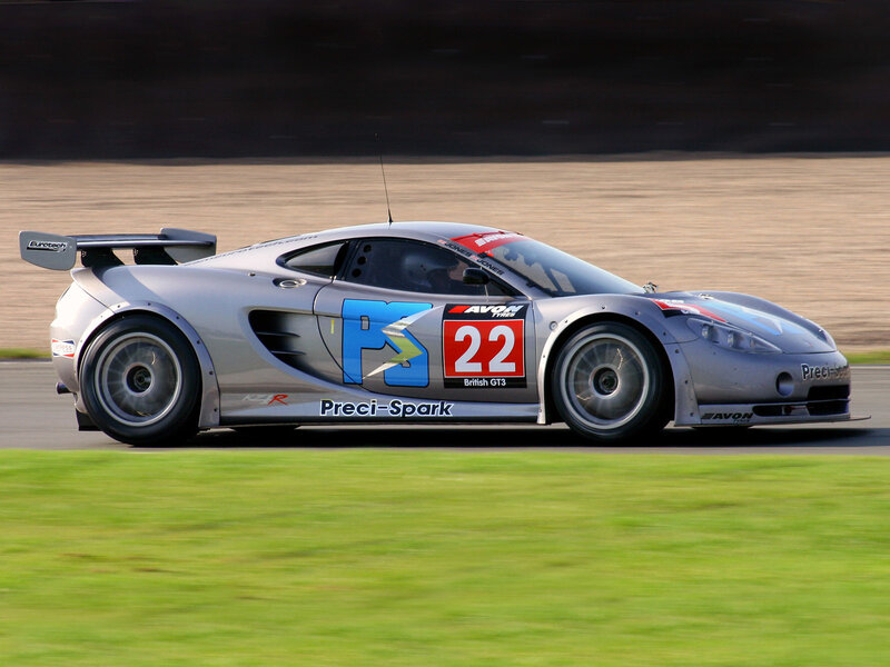 Silver Race Car — Dynamic, Afternoon, Photograph, Race Track, Grass, Driver