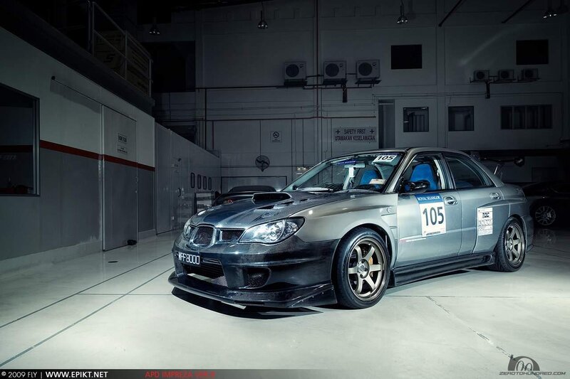 silver race car in garage