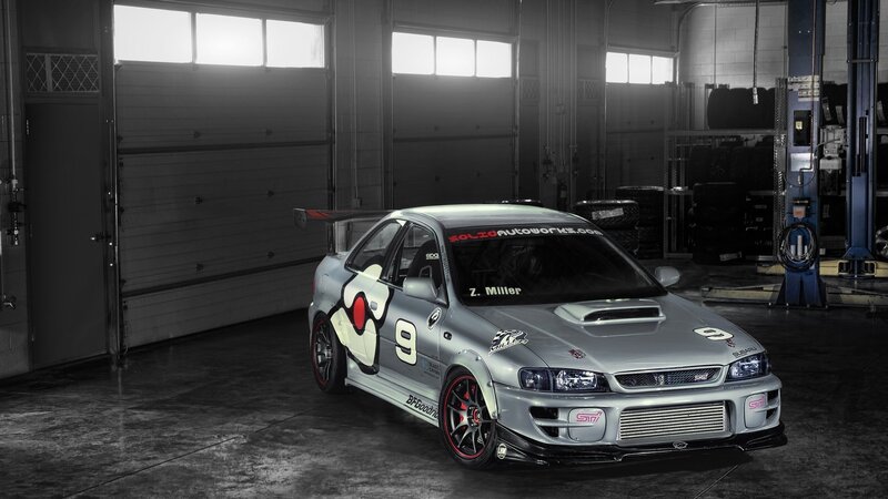 Silver Race Car in Garage — Gray, Dramatic, Photograph