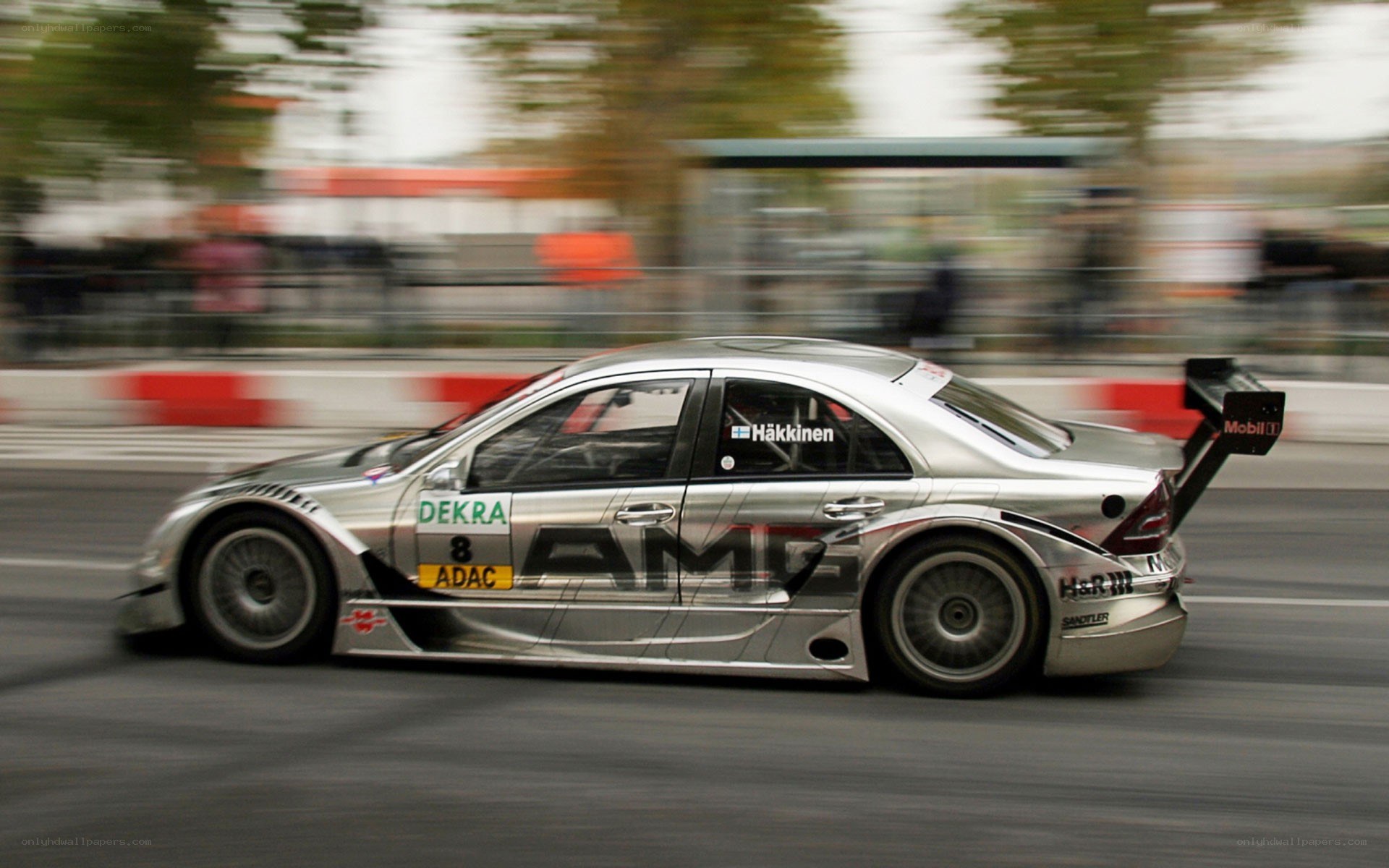 Silver race car in motion