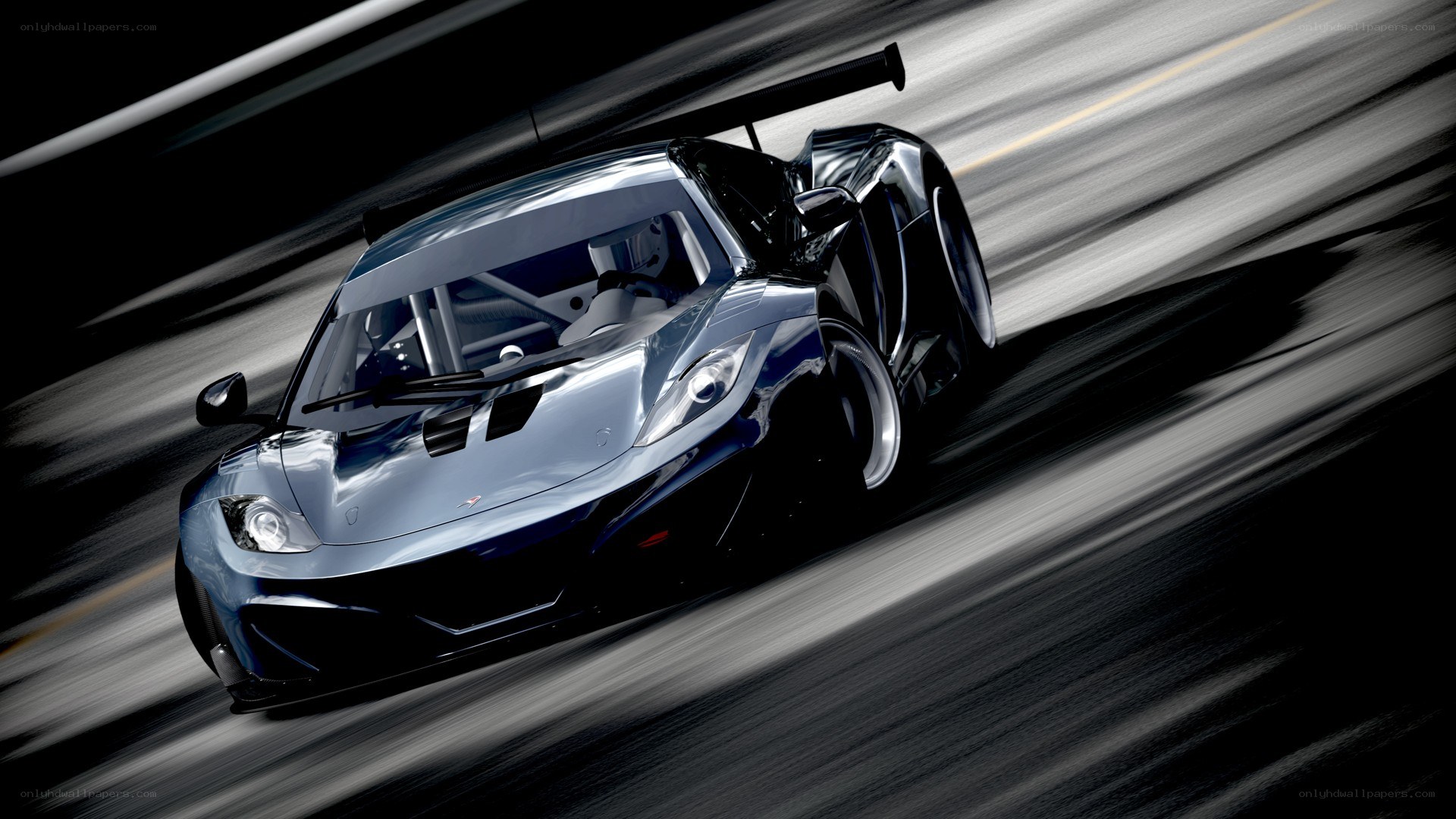 silver race car in motion