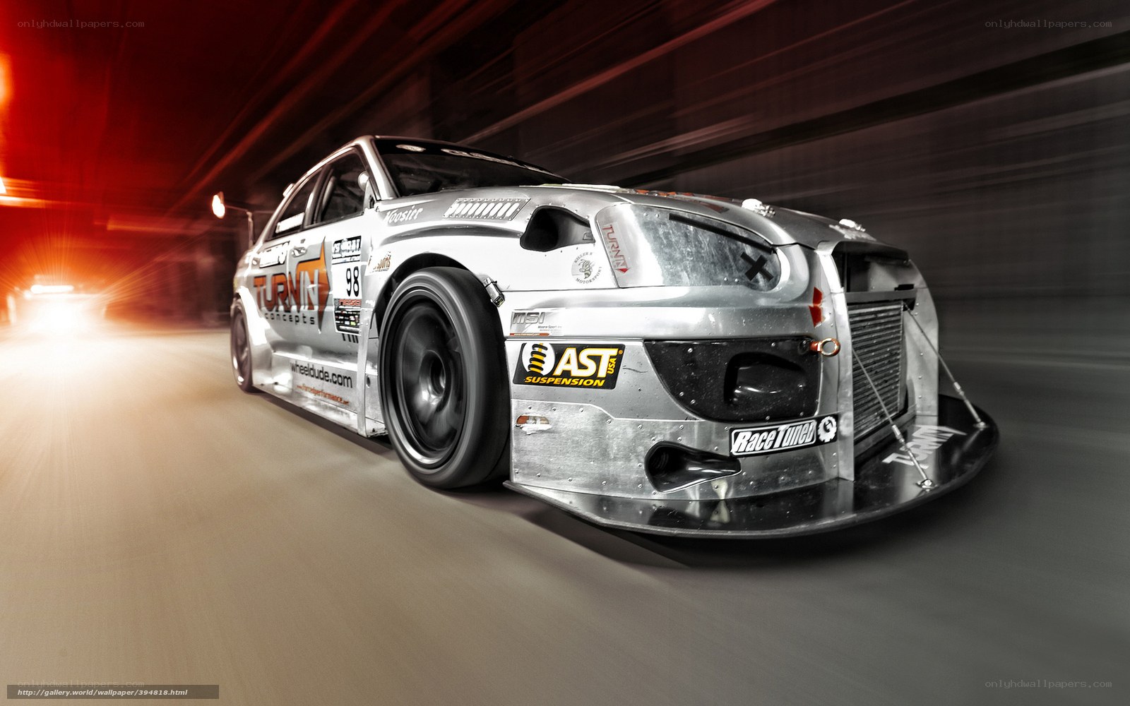 silver race car in motion