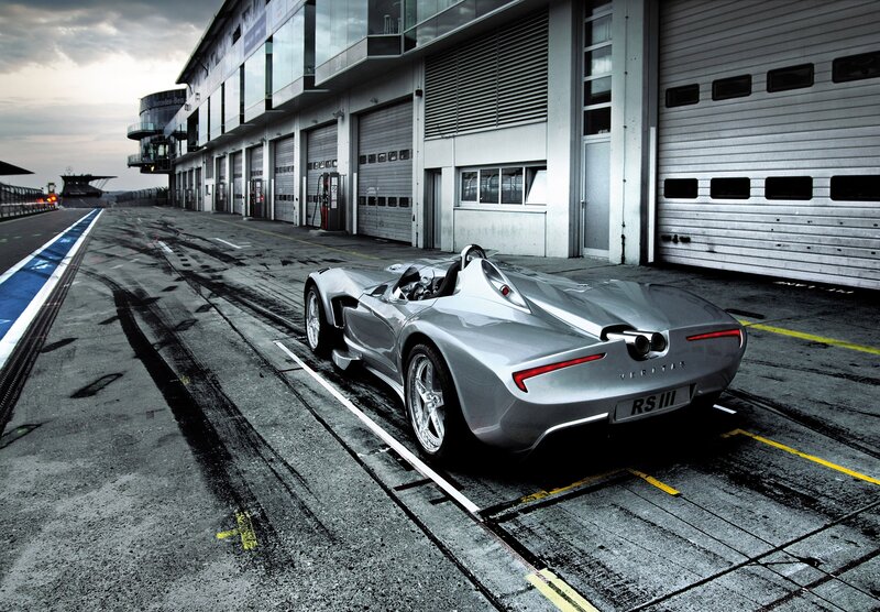 Silver race car in pit lane