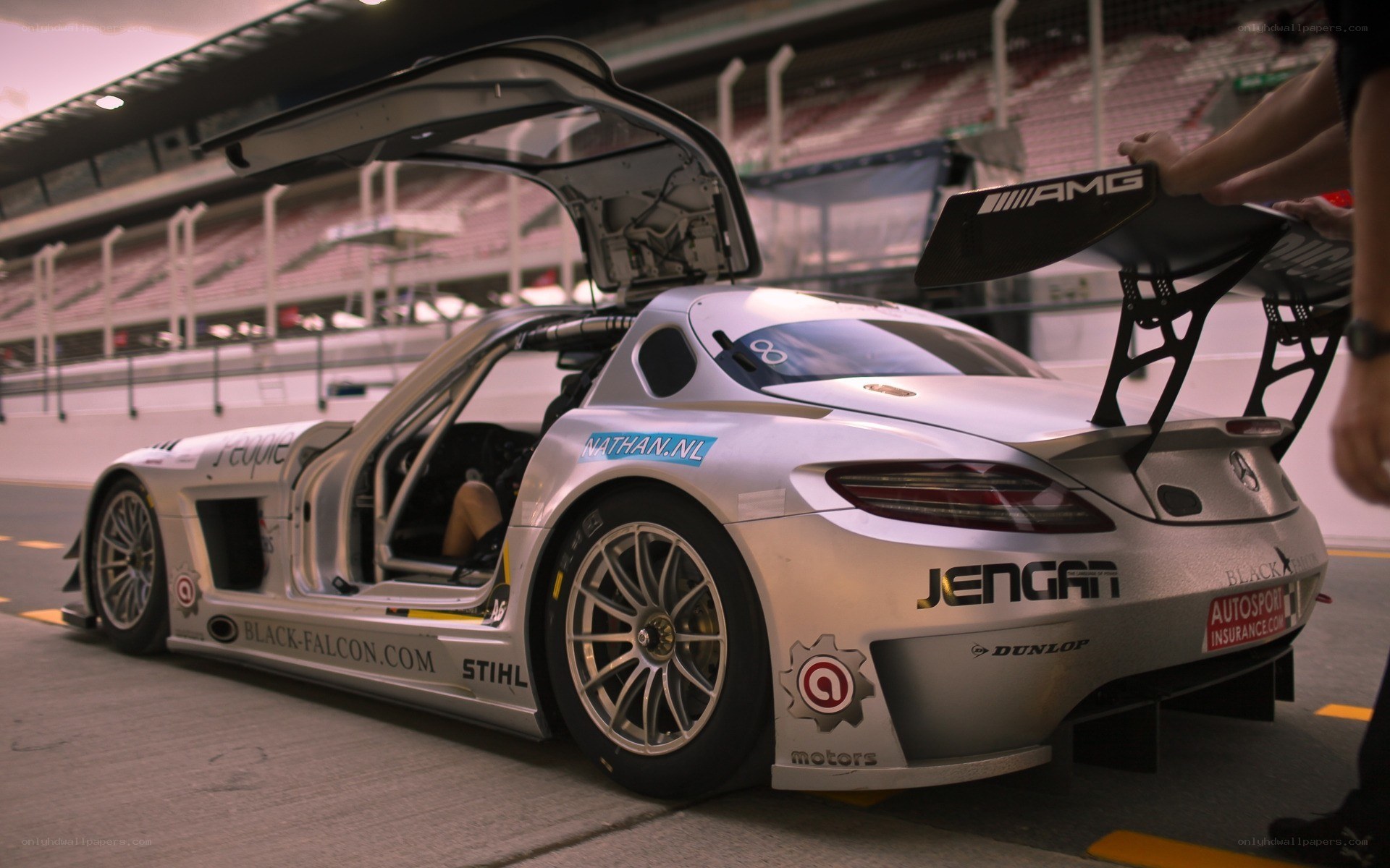 Silver race car in pit lane
