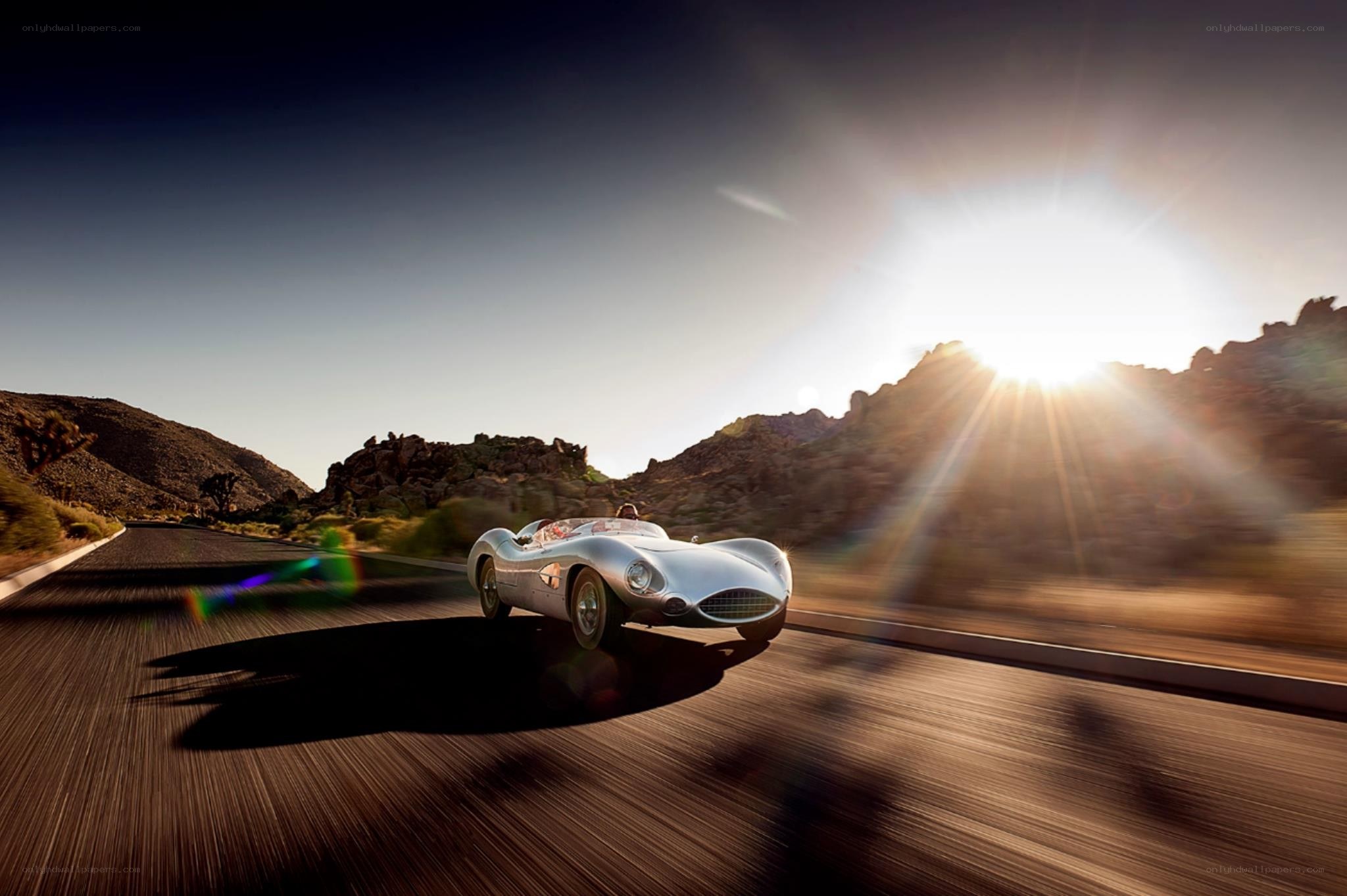 Silver race car on desert road