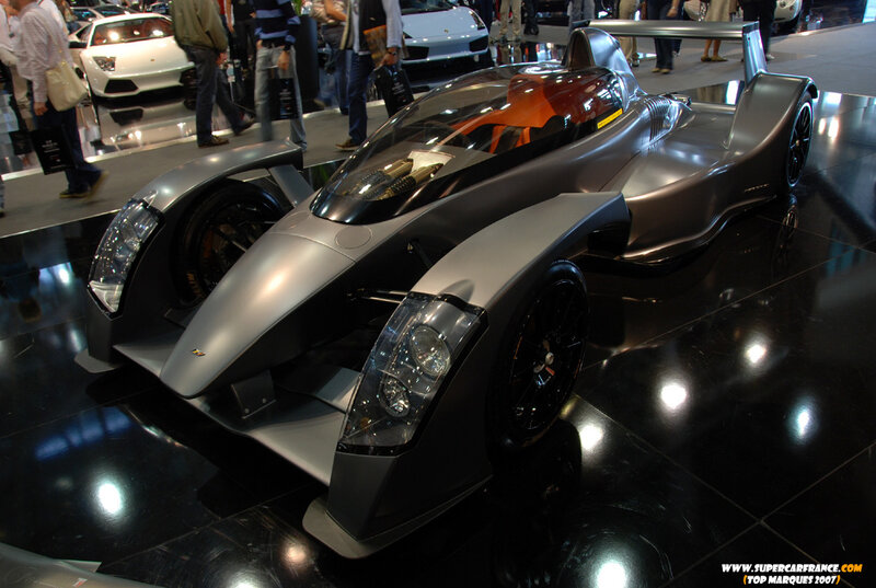 Silver race car on display