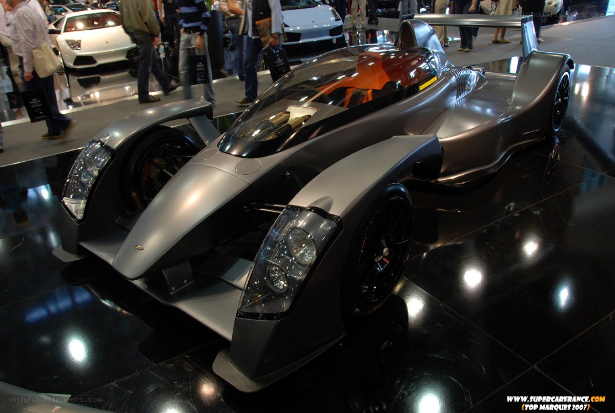 Silver race car on display