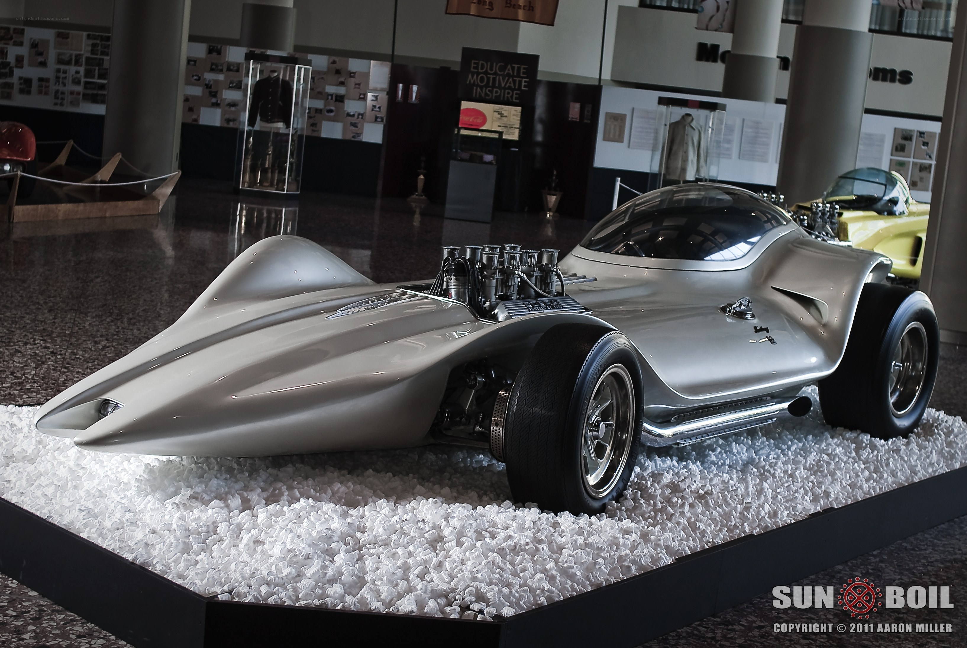 Silver race car on display