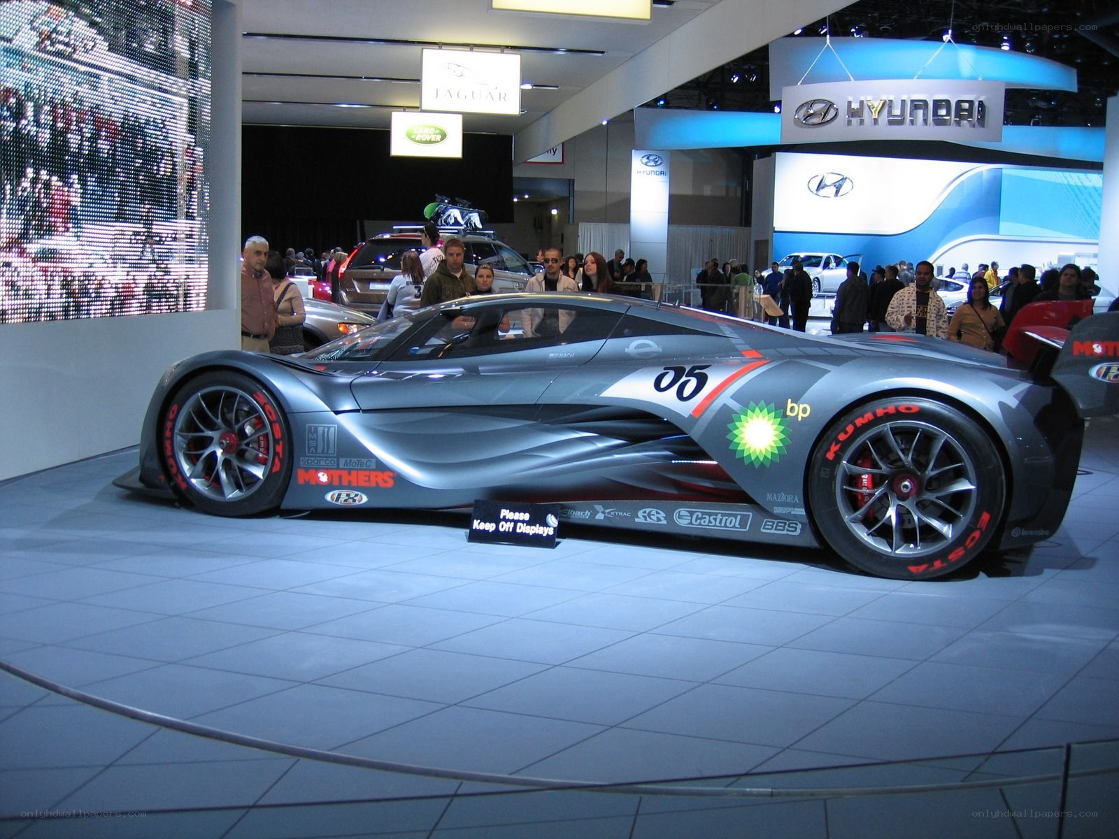 Silver race car on display