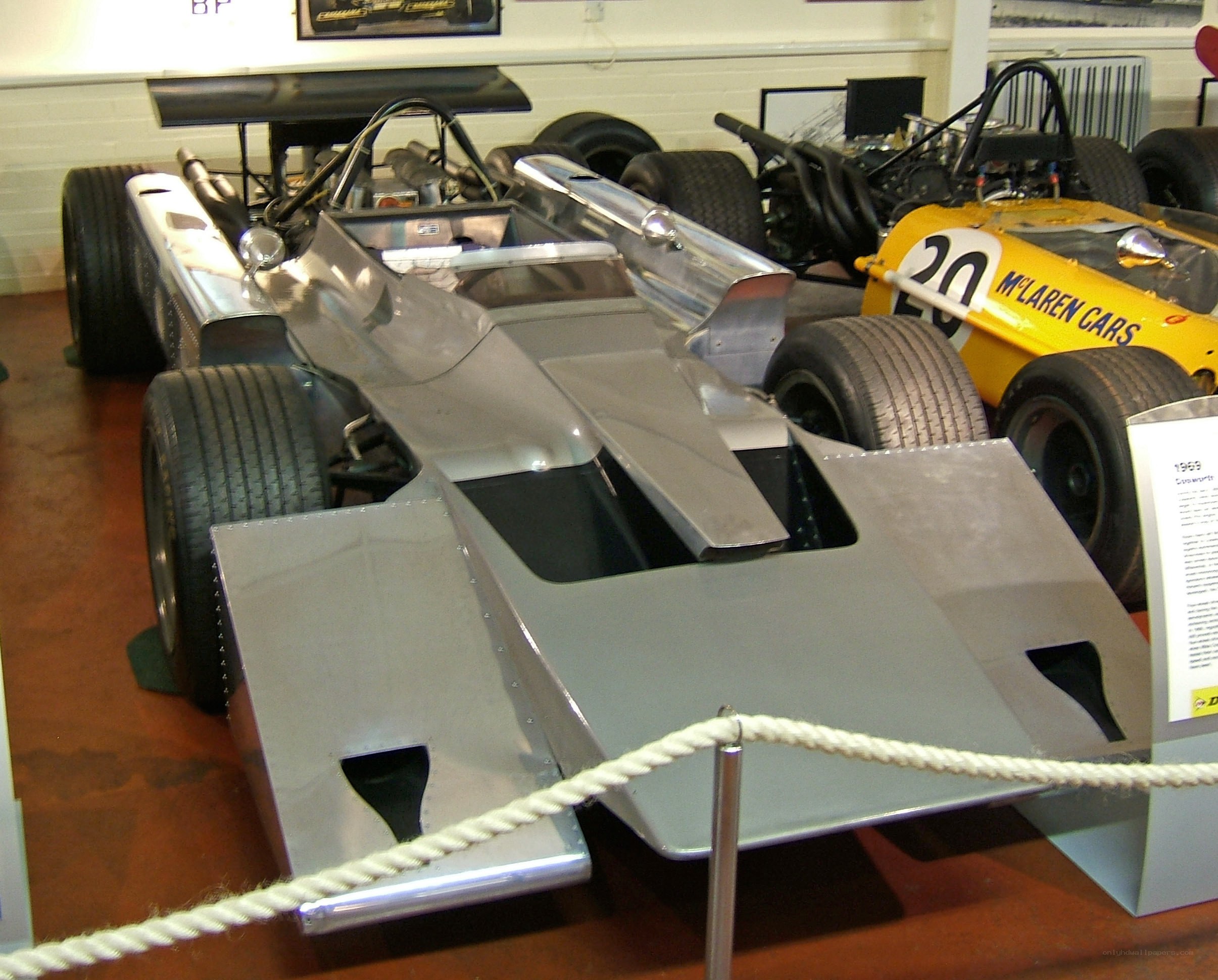 Silver race car on display