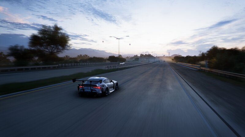 Silver Race Car on Highway