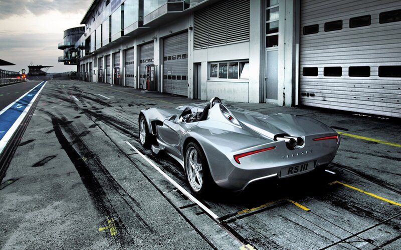 Silver race car on pit lane