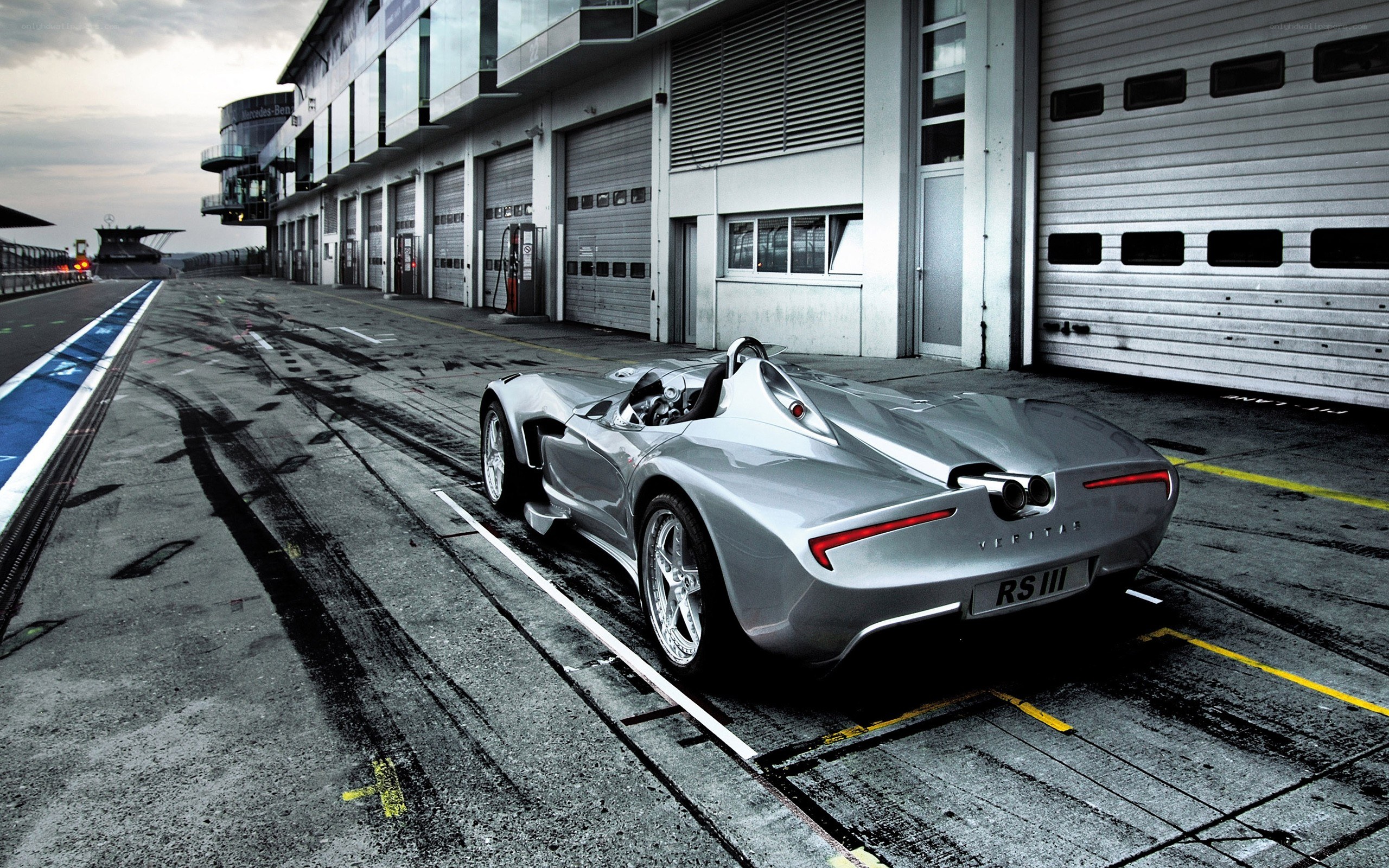 Silver race car on pit lane