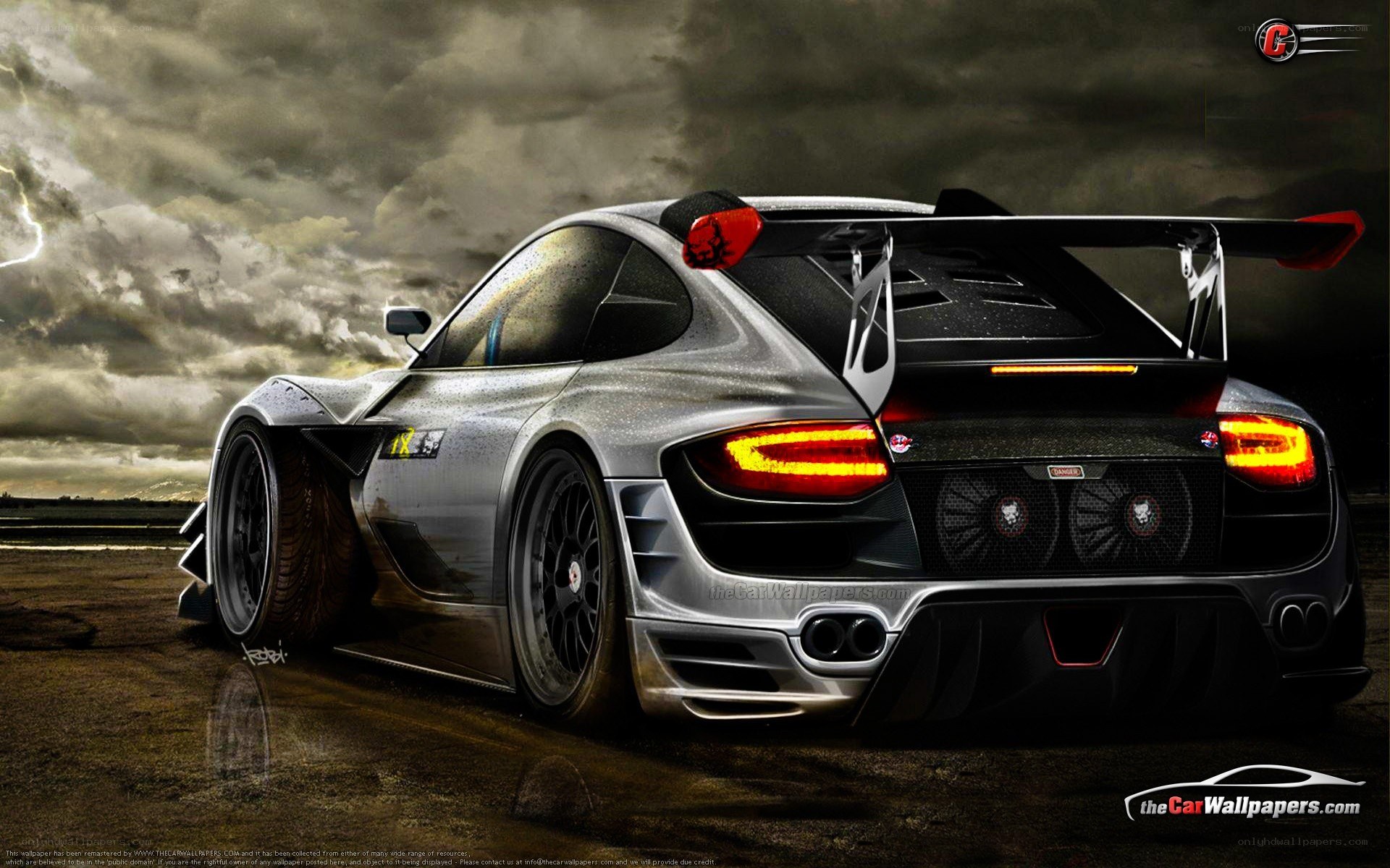 silver race car on stormy track