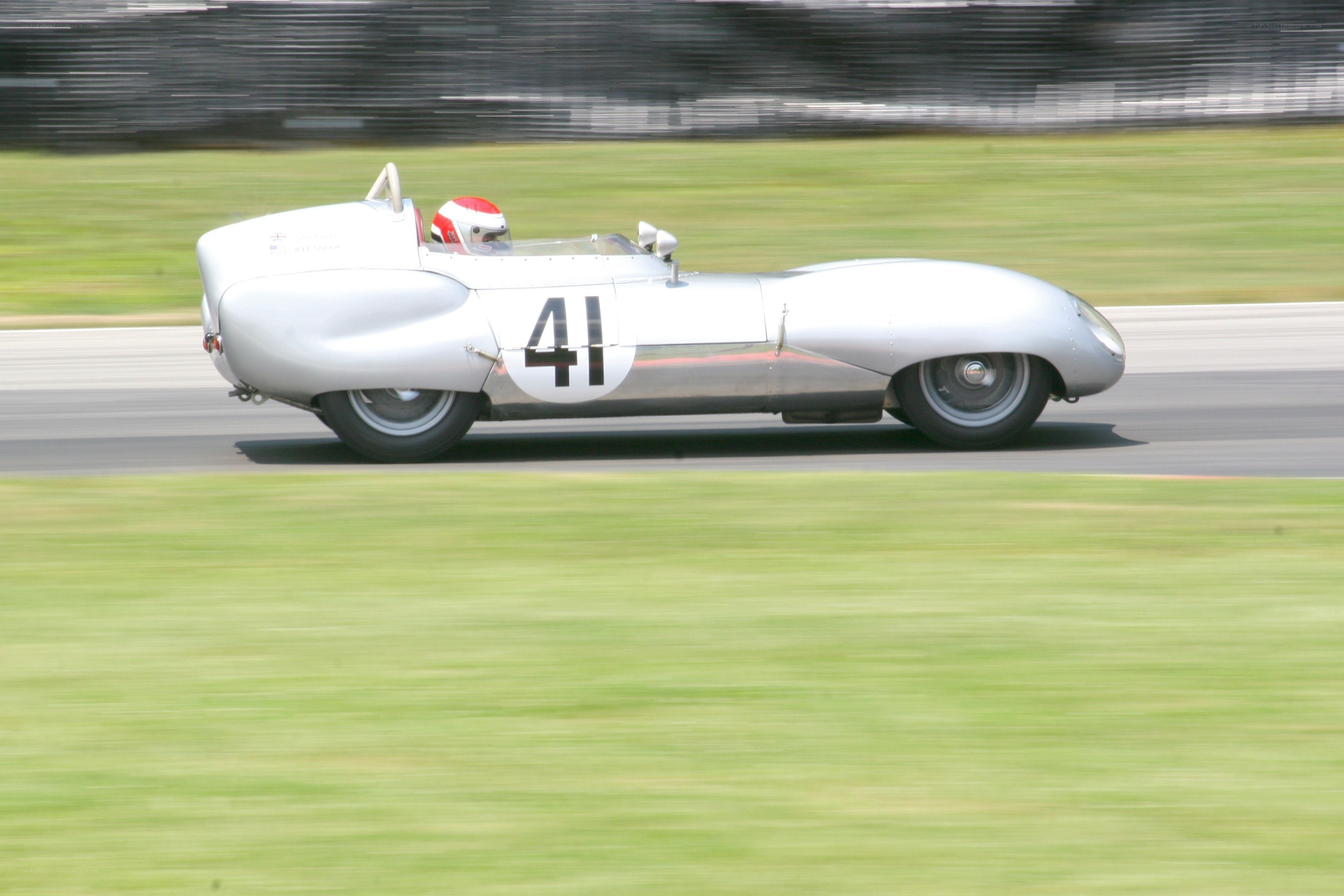 Silver race car on track