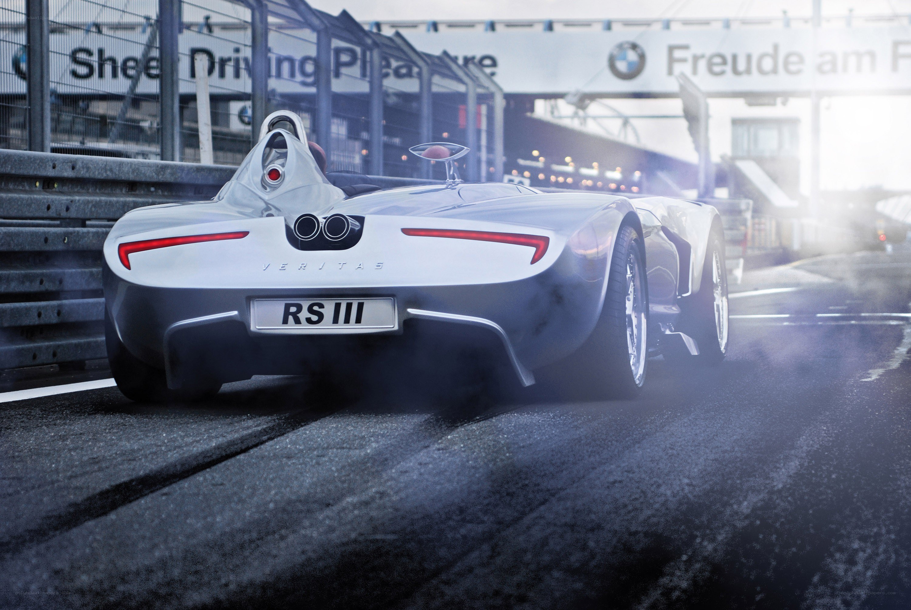 Silver race car on track