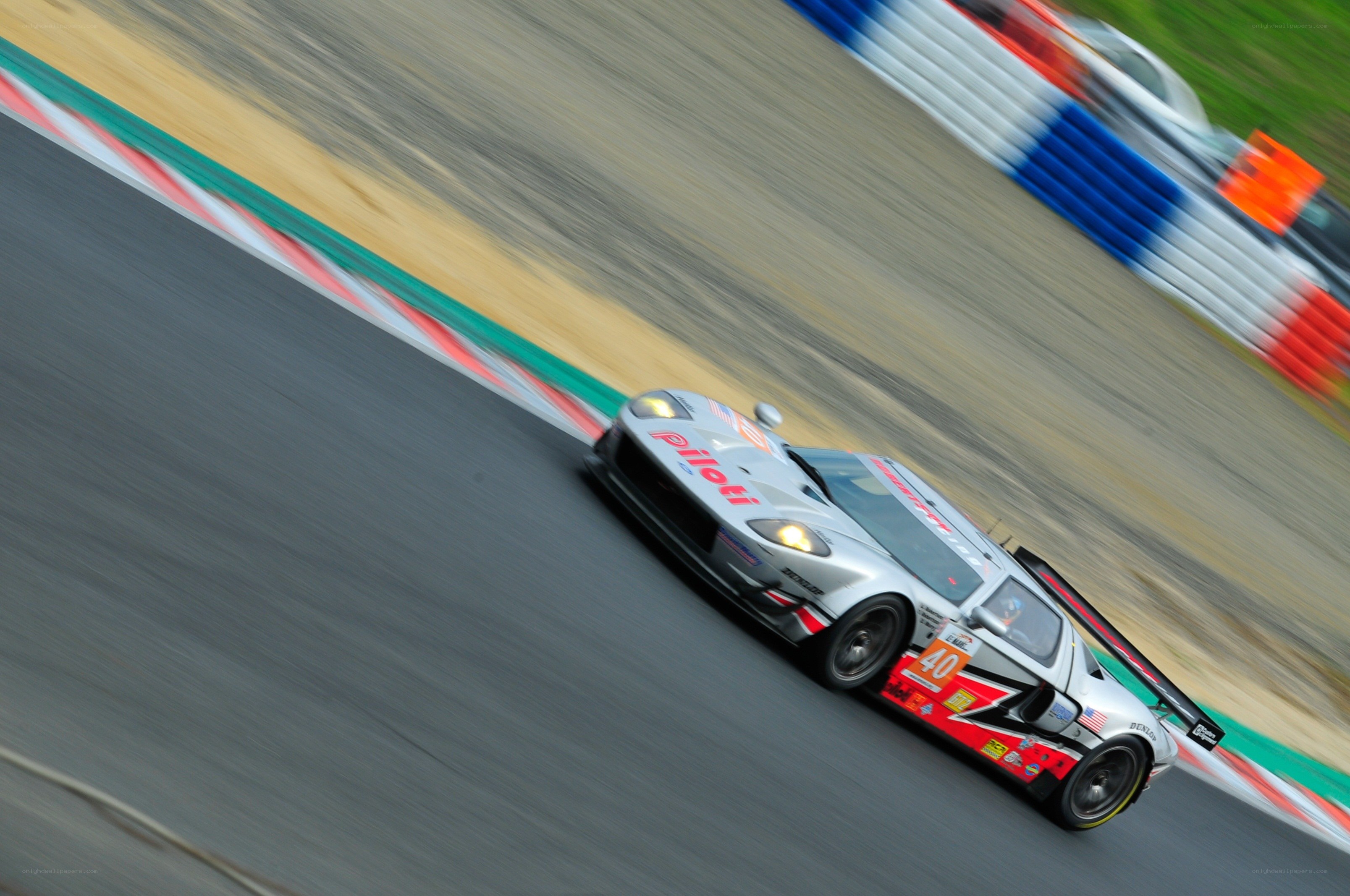 Silver race car on track