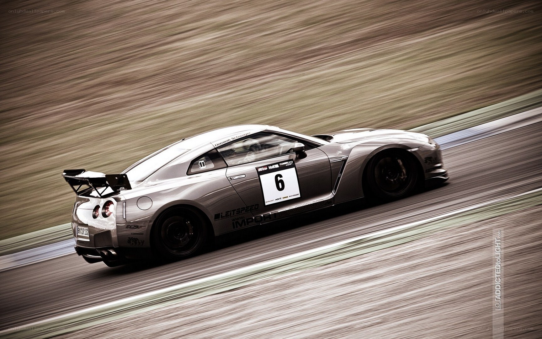 silver race car on track