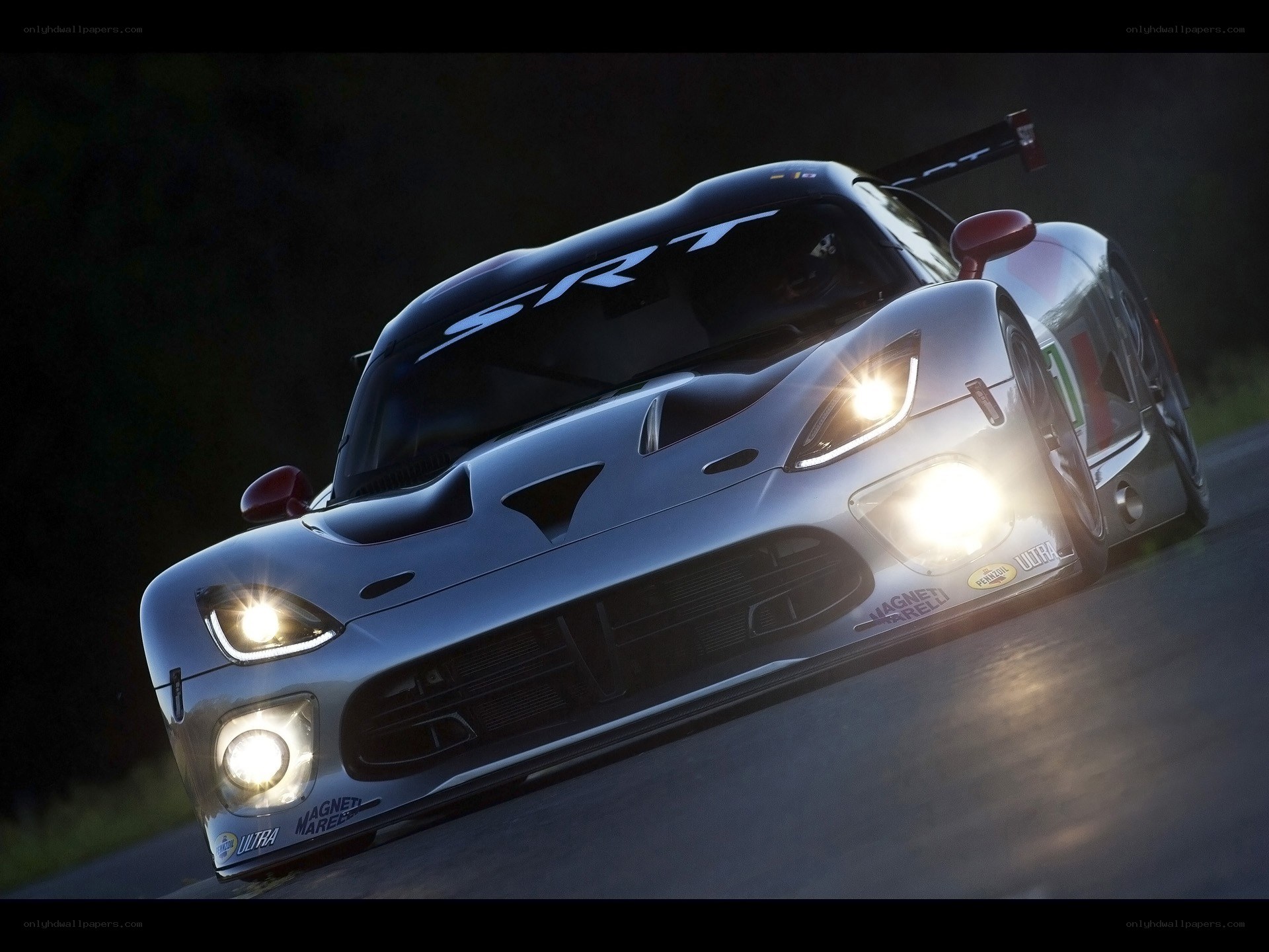Silver race car on track