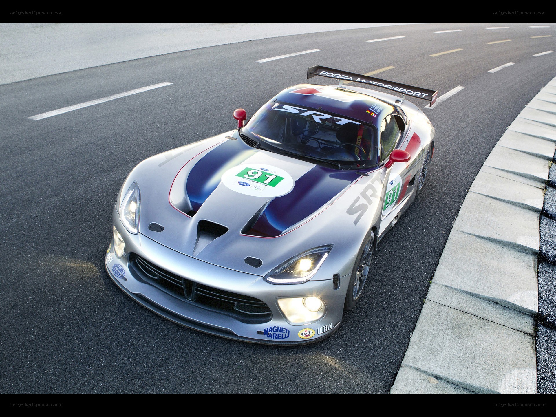 Silver race car on track