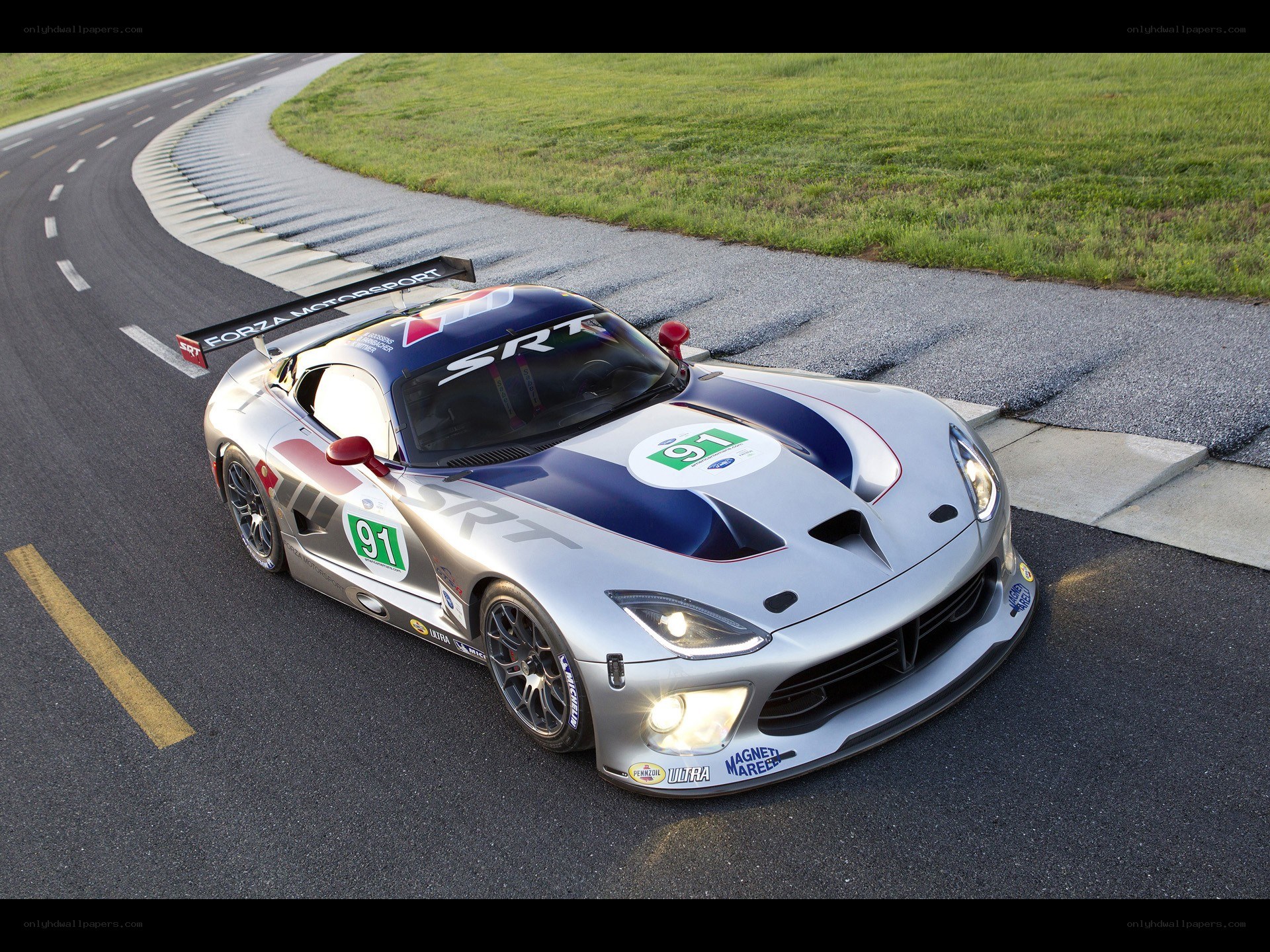 Silver race car on track