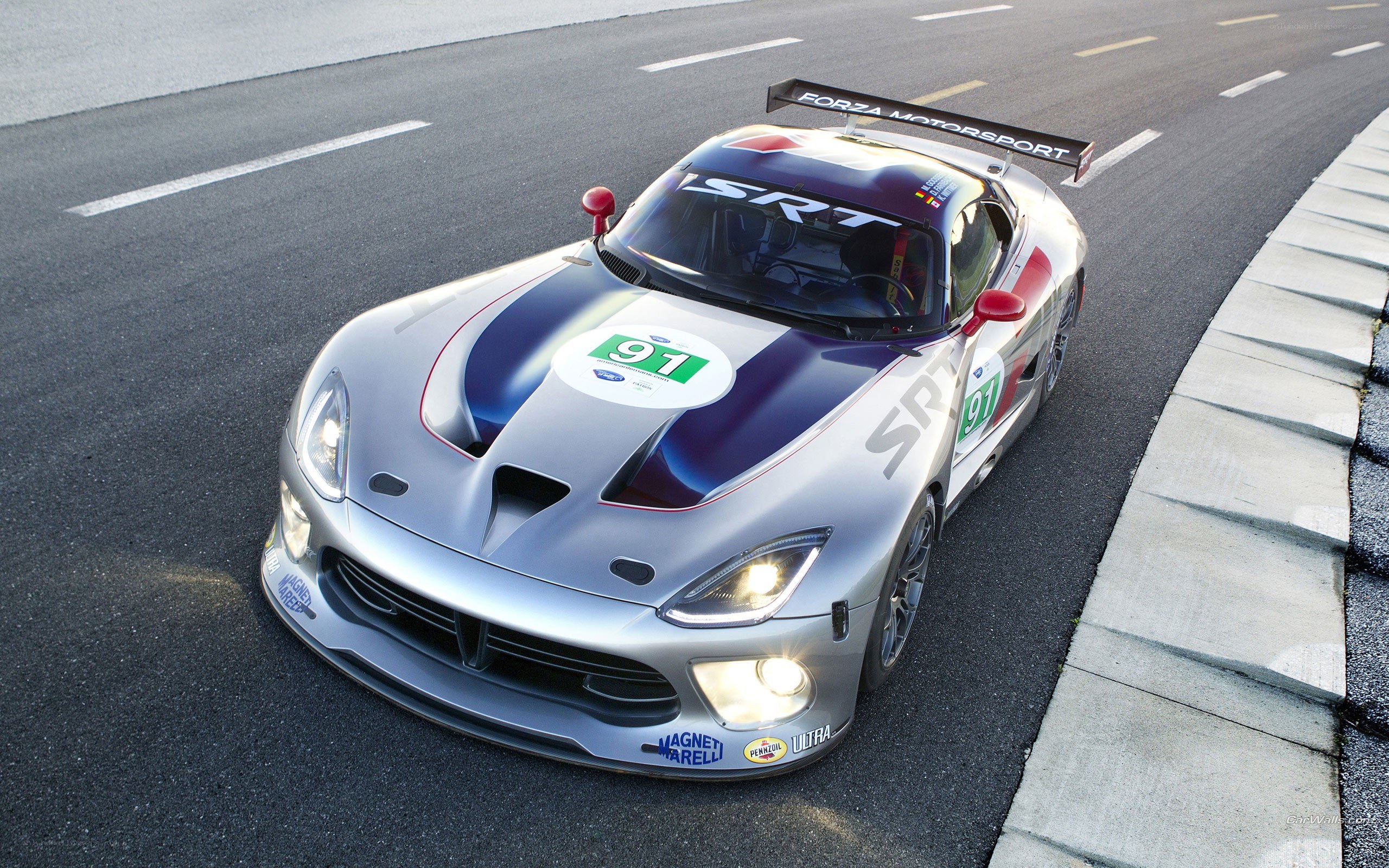 Silver race car on track