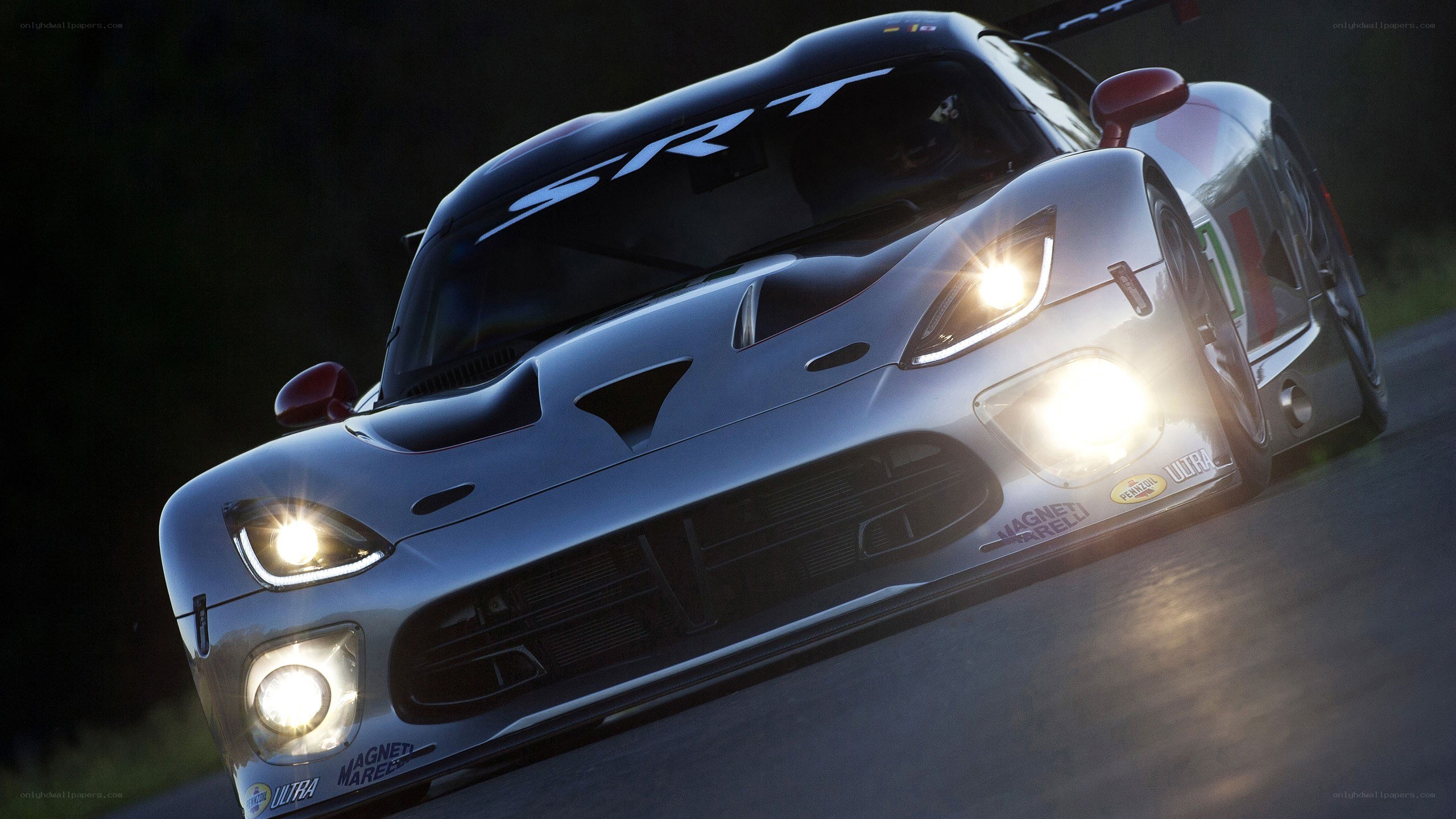 silver race car on track