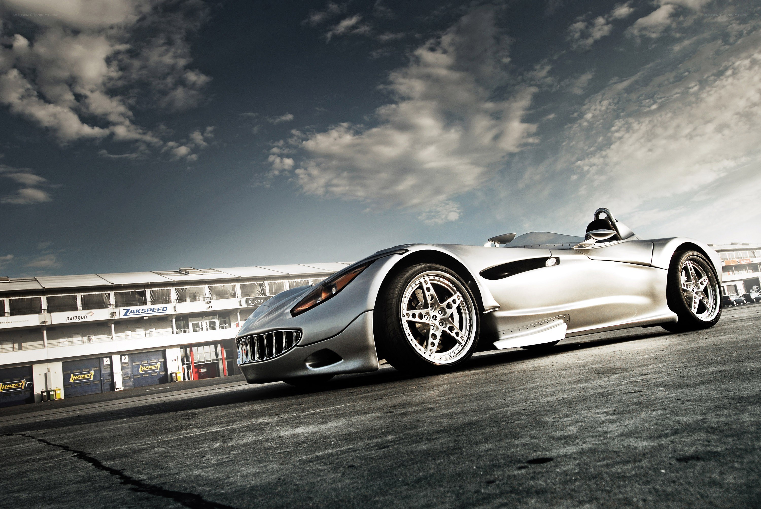 silver race car on track