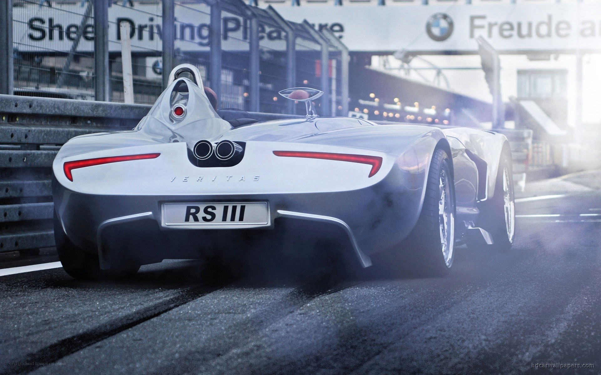 Silver race car on track