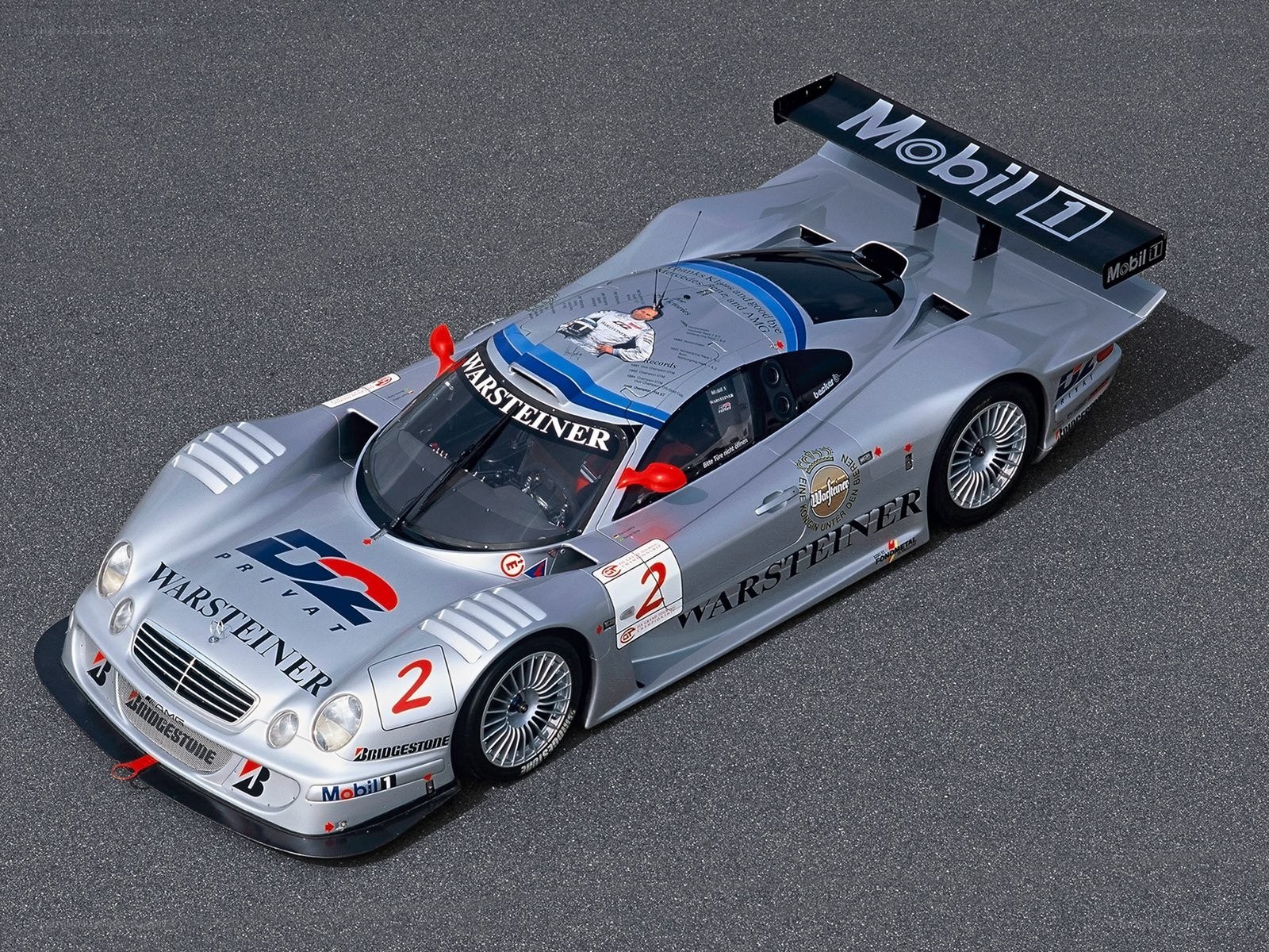 Silver race car on track