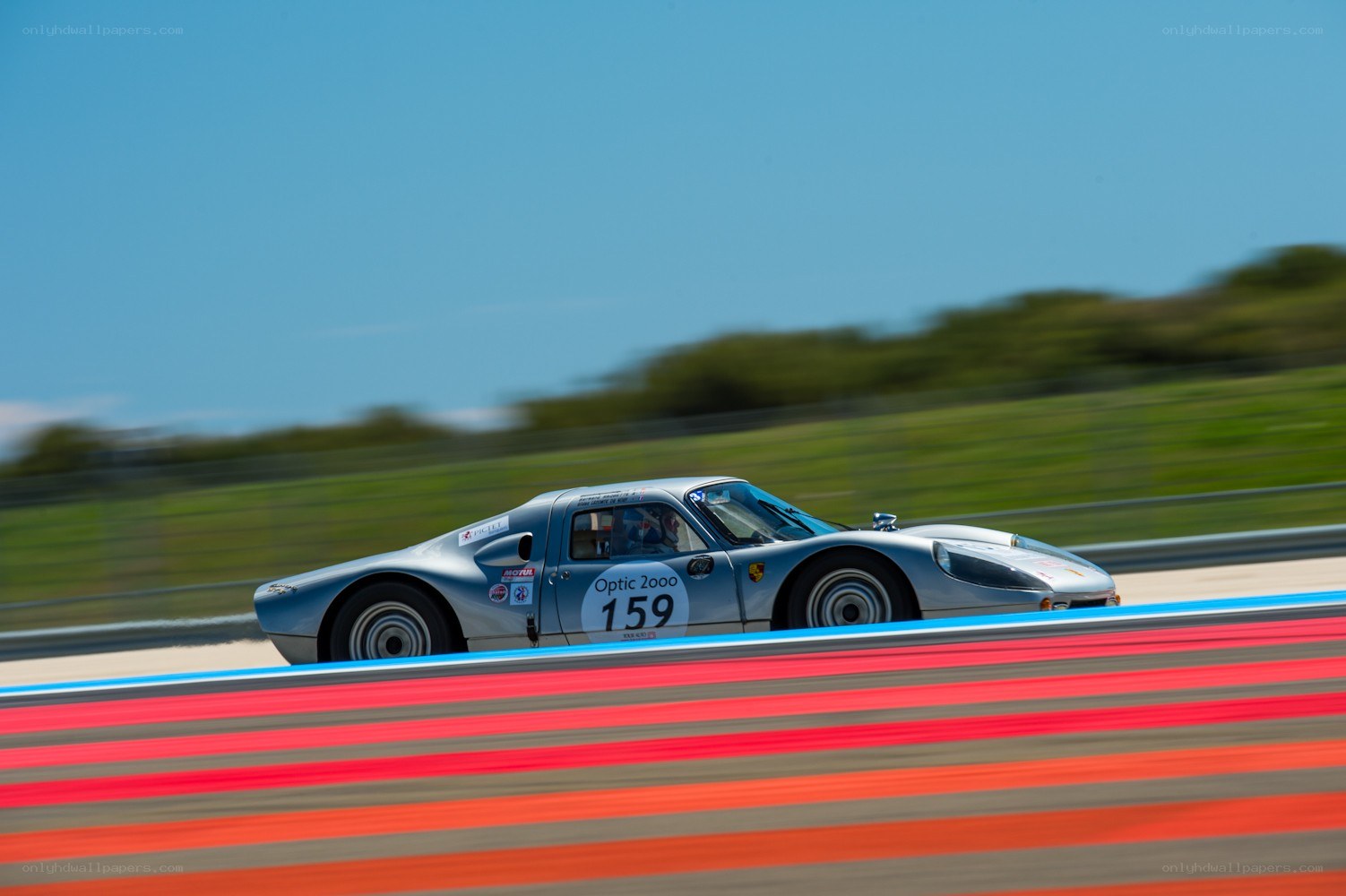 Silver race car on track