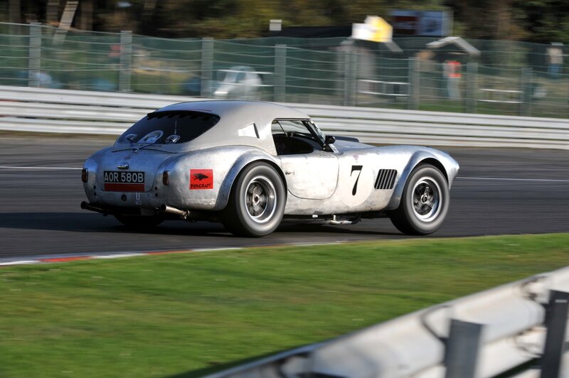 silver race car on track