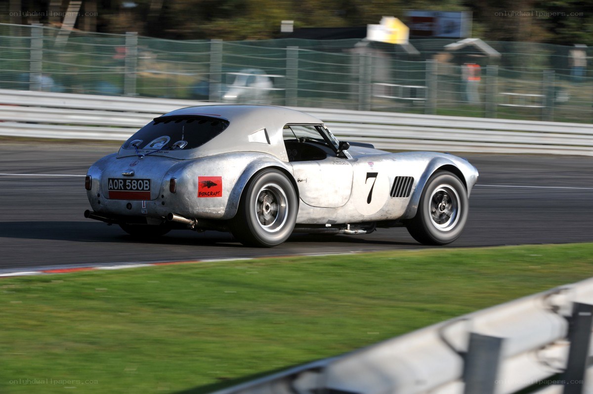silver race car on track